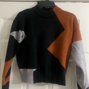 Chic Geometric Sweater in Black, Rust, and Gray